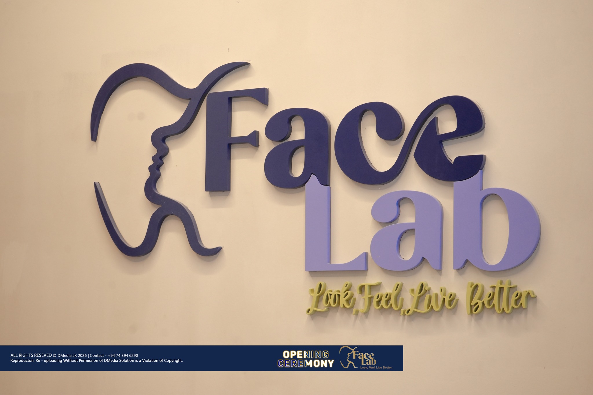 The dimensional FaceLab brand mark on the reception wall