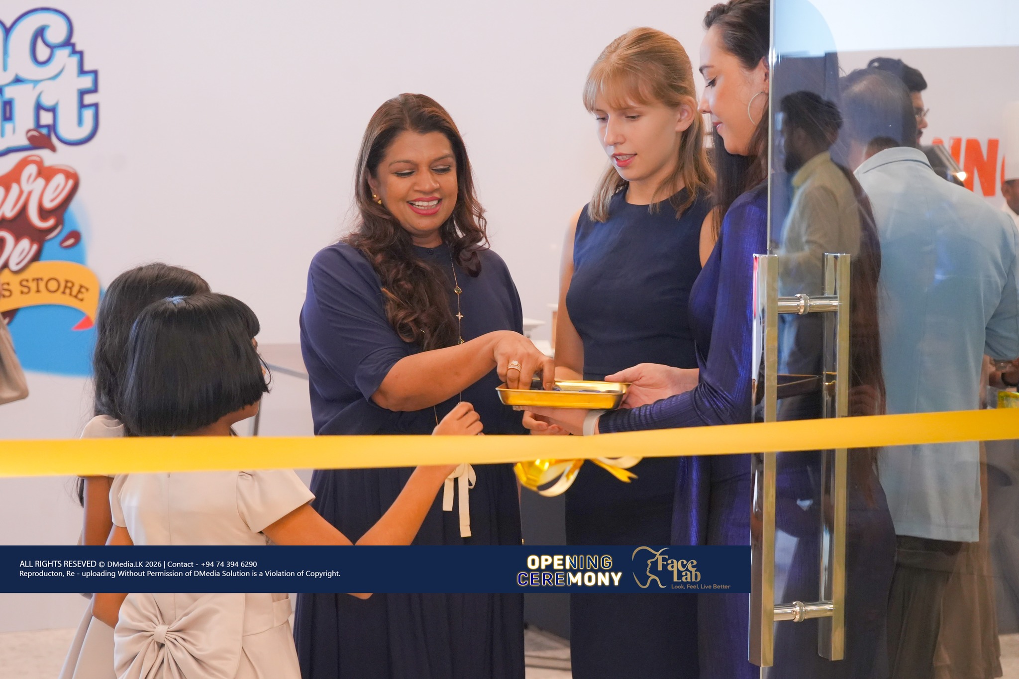 Guests cut the ceremonial ribbon at the FaceLab entrance