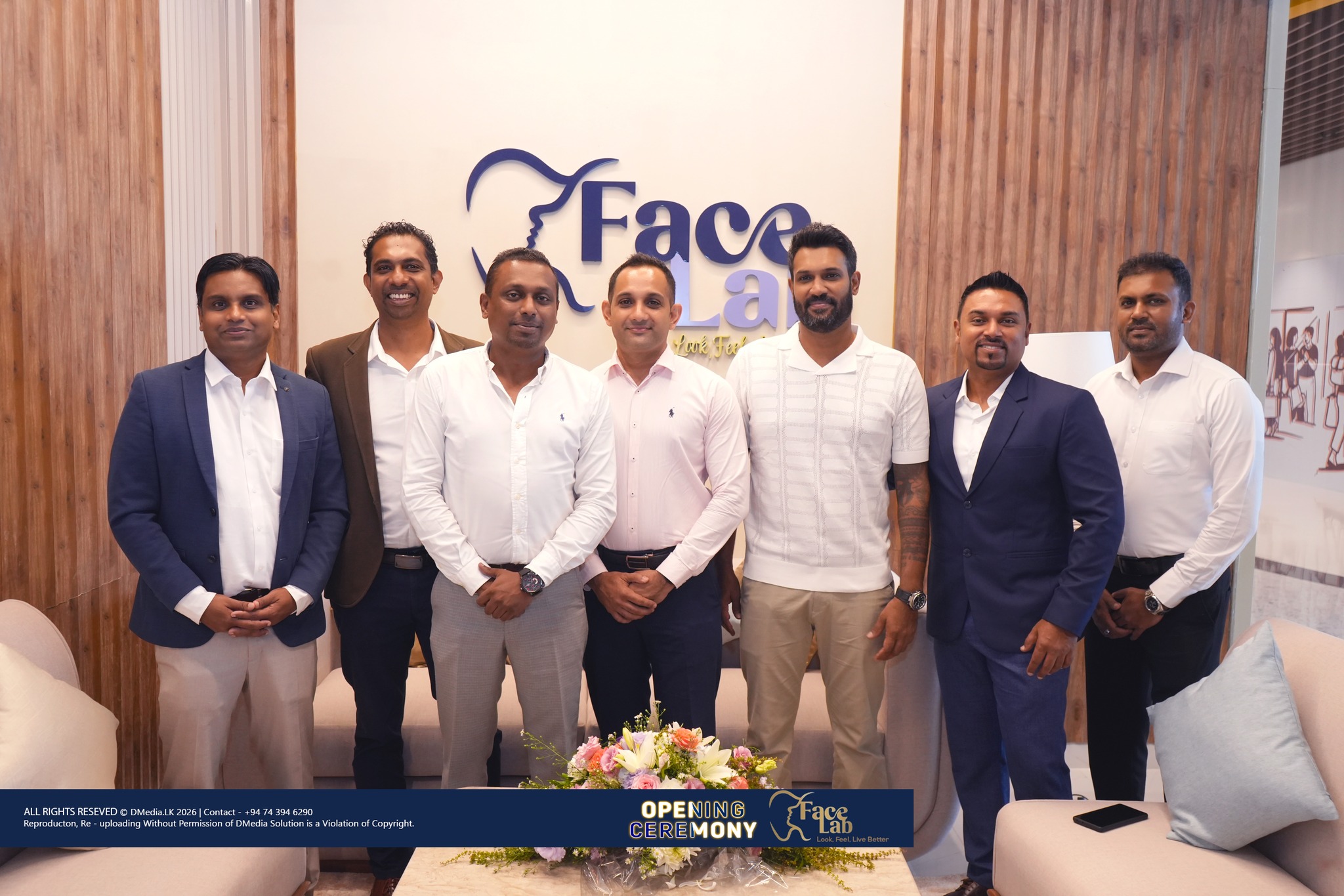 Distinguished guests gathered at the FaceLab brand wall on opening day
